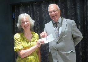 Barbara Thomas recieves the donation on behalf of the Yellowmen